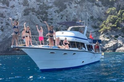Alcudia 3hr Sunset Trip with Drinks, Tapas, SUP & Snorkel - The route: cliff sides, caves, and the Alcanada Lighthouse sunset anchor