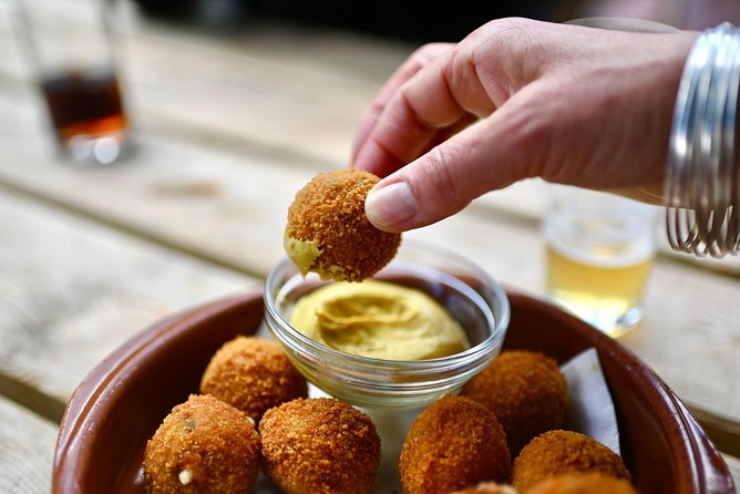 Amsterdam Food Tour of 10+ Local Classic Tastings in Jordaan Area - The walking highlights you pass: Westertoren, Anne Frank area, and a memorial