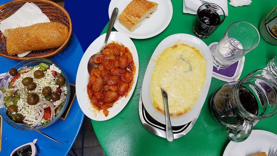 Athens: Traditional Greek food tour in hidden spots - The market loop: fish, meat, fruit, and spice stalls