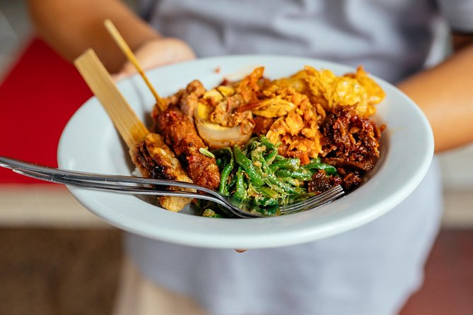 Bali Private Food Walking Tour With Locals: The 10 Tastings - The In-Between Stops: Catur Muka Statue and Kuta Puri Bungalows