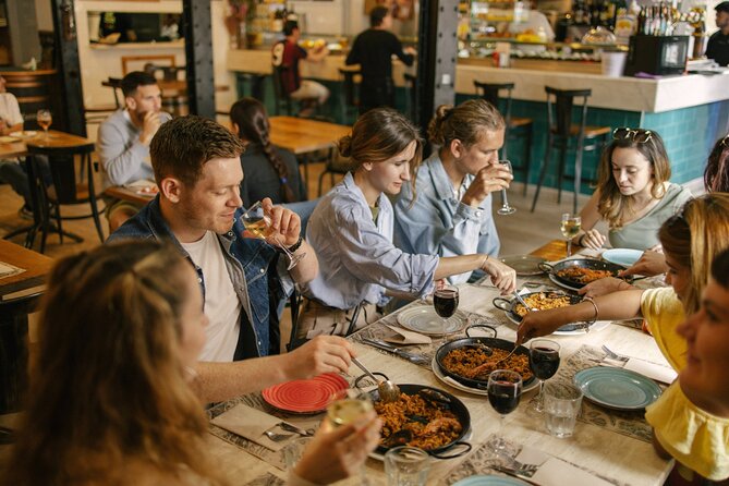 Barcelona: Guided Food Walking Tour with Tapas and Wine - What you get from the guide: stories, explanations, and ordering help