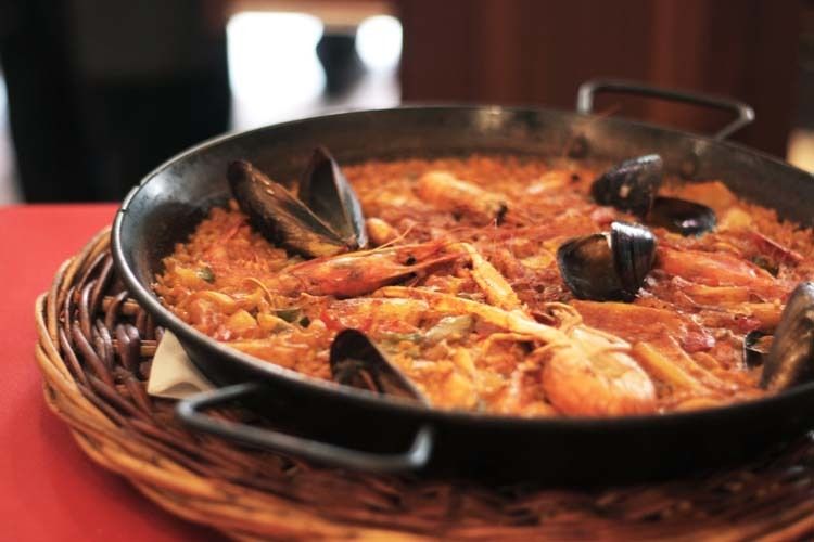 Barcelona: Old Town Tapas & Paella Food Tour with 8 Tastings - Tapas at a family-run spot (and what to do with the wine)
