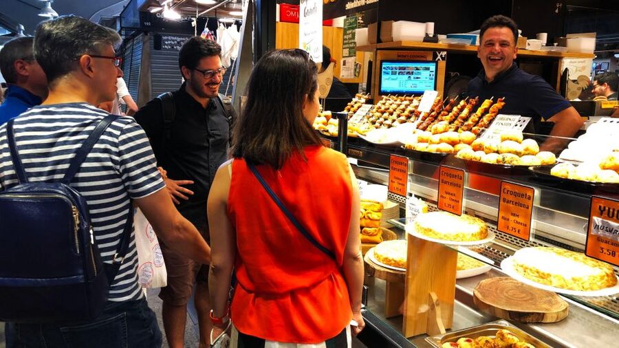 Barcelona: Street Food & Sightseeing Tour with Local Market - Price and value: $53 for 2.5 hours of guided eating