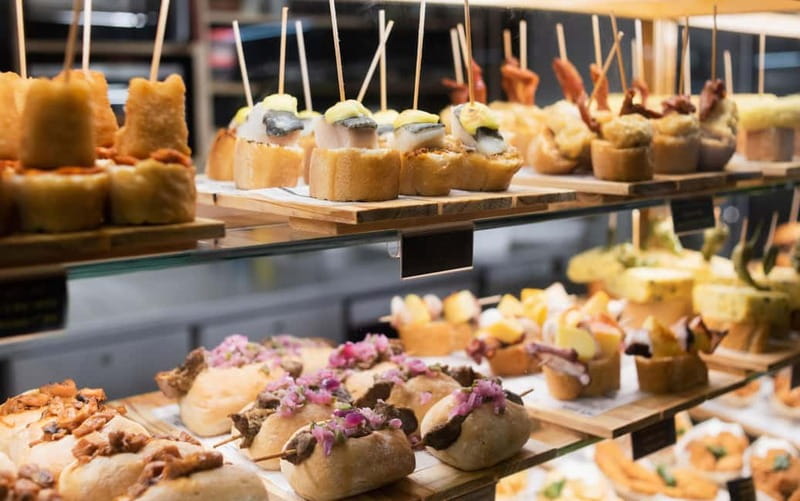 Barcelona: The Ultimate Local Tapas & Drinks Food Tour - Peppers, Bread, and Montaditos: The Comfort Food Lineup