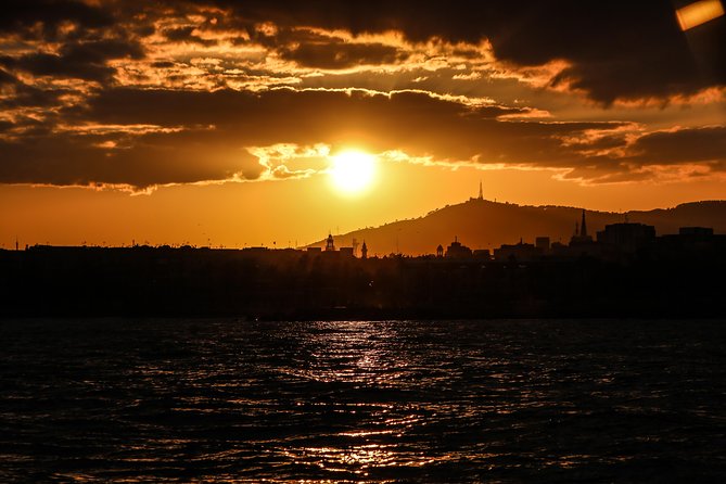 Barcelona Unique Sunset Sailing Experience with Tapas & Open Bar - Live musician upgrade: sax or guitar for your golden hour