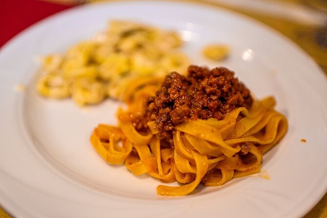 Bologna Food & Market Tour with 6 Tastings, Pasta, Wines & More - Palazzo della Mercanzia to Start: History You Can Actually Walk Off