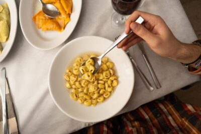 Bologna: Food Tour with Pasta Tasting & Local Specialties - First sit-down meal: pasta that defines Bologna