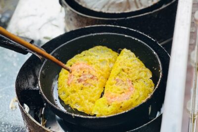 Committed Non-Touristy Saigon Street Food Tour By Scooters/Car - The night route: old apartments, Ho Thi Ky flowers, and Chợ Lớn after dark