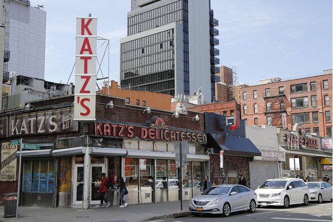 Devour New York Lower East Side Guided Food Tour - Essex Street Market for cheese and cured meats, plus Orchard Grocer’s vegan bagel swap