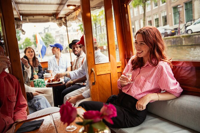 Eating Amsterdam: Food Tour & Canals Cruise - Meeting Noordermarkt and stepping into the Jordaan