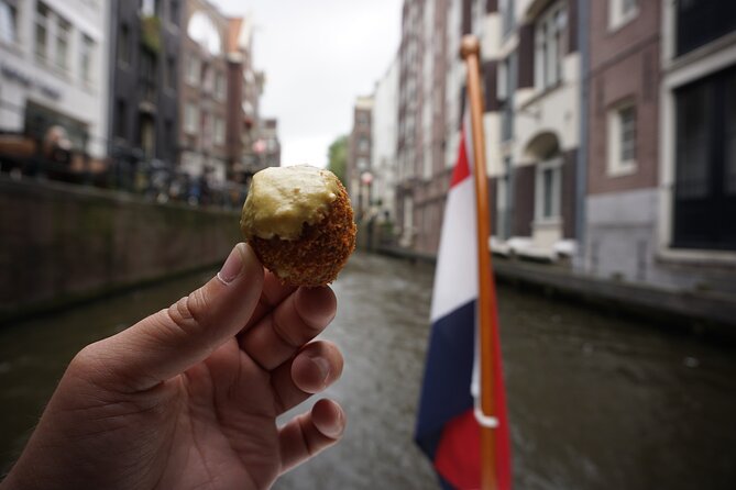 Eating Amsterdam: Food Tour & Canals Cruise - Café De Poort: a cozy gouda tasting in a classic brown café