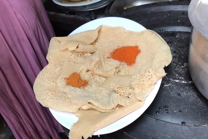 Ethiopian Culinary Tour - Market, Food, Coffee Ceremony & more - Lunch at Taitu Hotel and a Piassa-style break