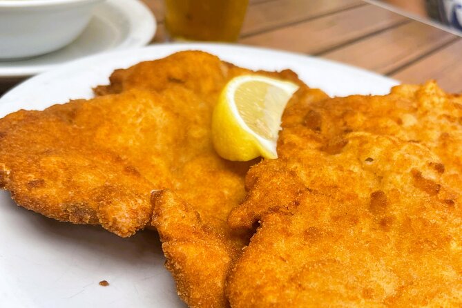 Food Tasting Tour in Hidden Gems of Vienna for Small Groups - Stop 1: Schnitzel Wirt and the Vienna logic of crispy veal