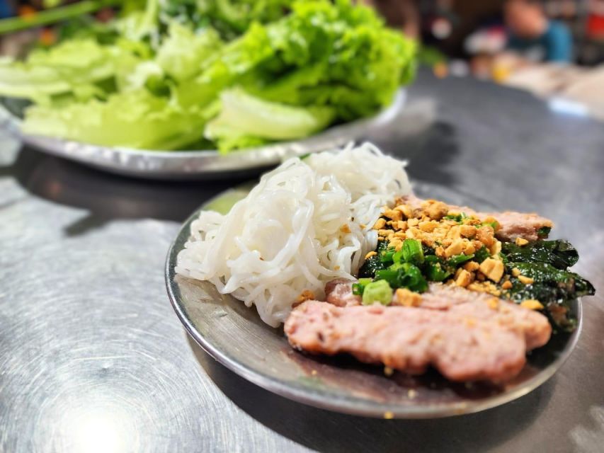 Ho Chi Minh City: Food Tour by Scooter with Eleven Tastings - Flower market snacks: Vietnamese pizza, grilled crackers, and stuffed snails