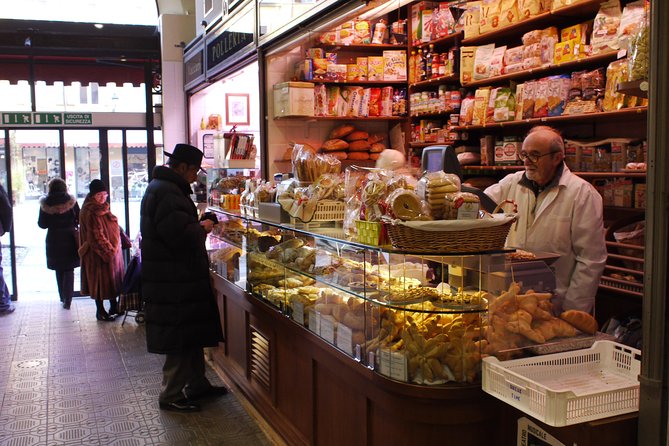 Intimate Modena Food Tour: Market & Local Secrets (Max 8) - Mercato Albinelli: aged Parmigiano Reggiano in a place that smells like work