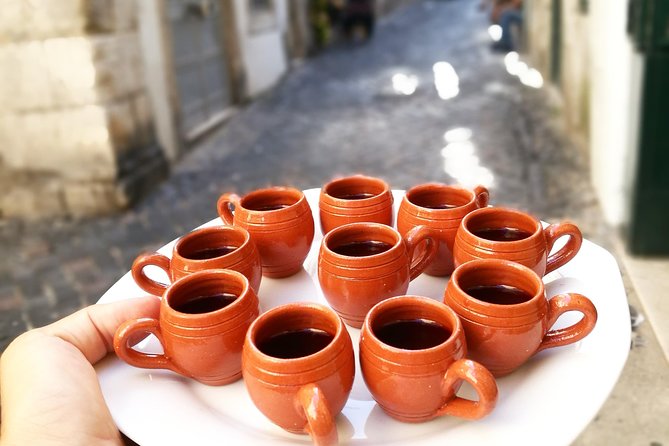 Lisbon Small-Group Food Tour with 18 Tastings in Alfama District - Alfama tastings: land and sea, plus classic Portuguese plates