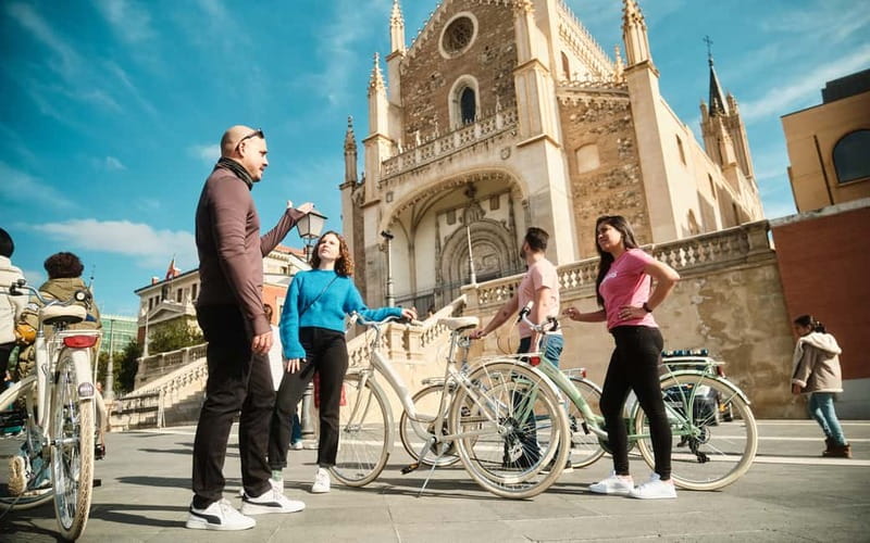 Madrid: Highlights Guided Vintage Bike Tour and Tapas Option - Las Letras Quarter: culture you can feel between photos