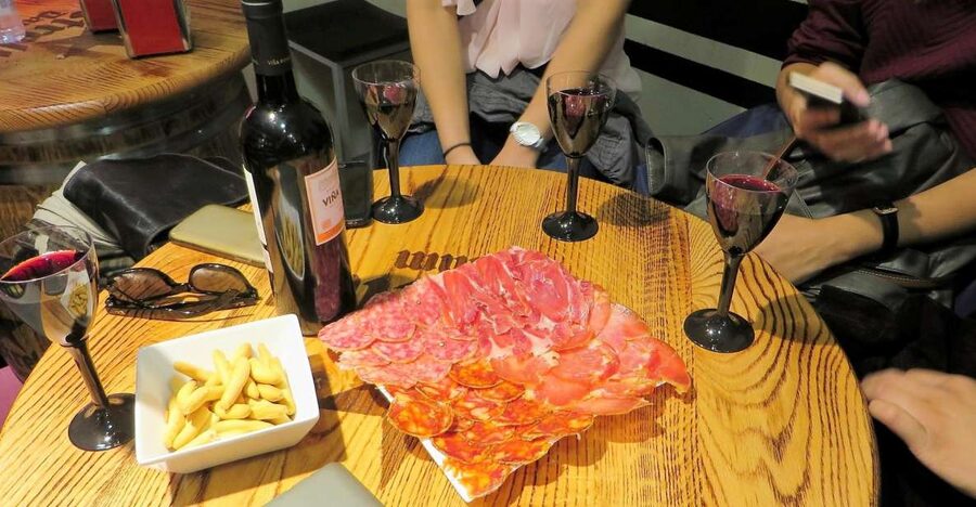 Madrid: Iberico Ham and Spanish Wine Small-Group Food Tour - Iberian ham grades and labels: serrano vs Ibérico, jamón vs paletilla