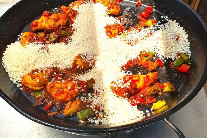 Madrid: Paella & Sangria Classes- Seafood, Chicken & Vegan option - Paella cooking in the kitchen: seafood, chicken, or vegan