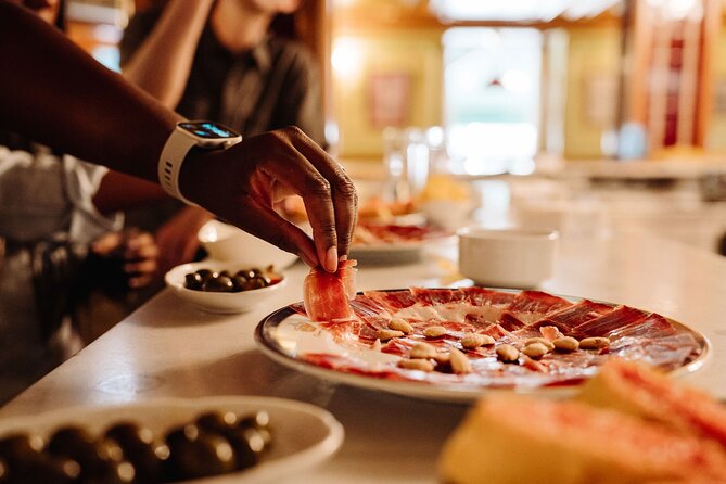 Madrid Tapas & Taverns Small Group Food & History Tour - Stop 2: El Escarpín, Asturias food, and traditional cider pouring