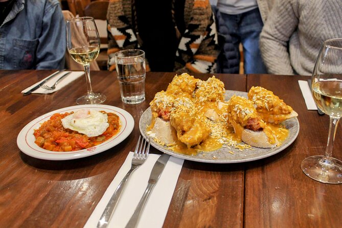 Madrid Tapas, Wine and History Tour - Four tavern stops: how the tastings turn into a full meal