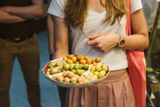 Madrid Ultimate Spanish Cuisine Food Tour - Mercado Antón Martín: olives, cured meats, olive oil, and vermouth