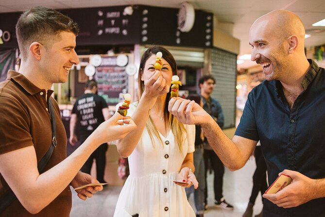 Madrid Ultimate Spanish Cuisine Food Tour - Casa González deli: cheese, two wines, and a story with teeth