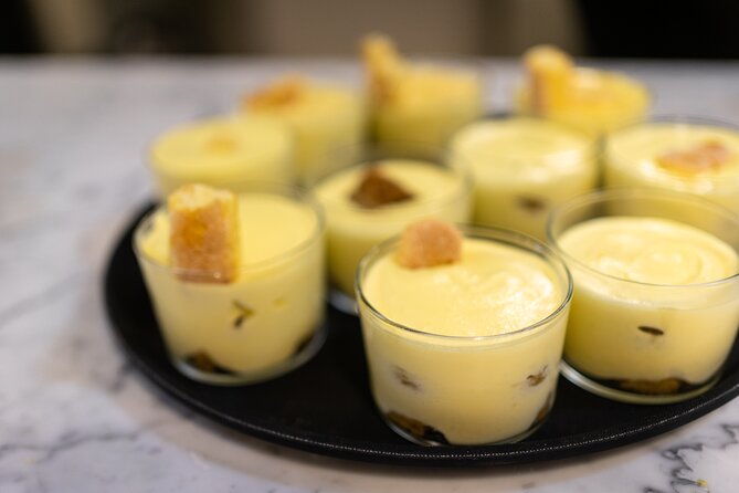Milan Culinary Experience: Pasta & Gelato or Tiramisù Class - Entering the cooking school above Mercato Centrale