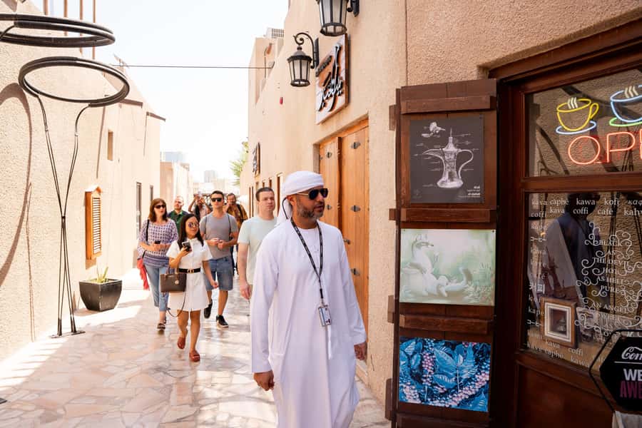 Old Dubai Historic Guided Tour: Creek, Street Food & Souks - Heritage house time inside Al Fahidi: the stories that make the streets click