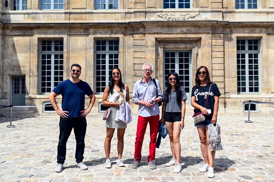 Paris: Le Marais District Food Tour with 10+ Tastings & Wine - Walking Le Marais between tastings: Place des Vosges and the older streets