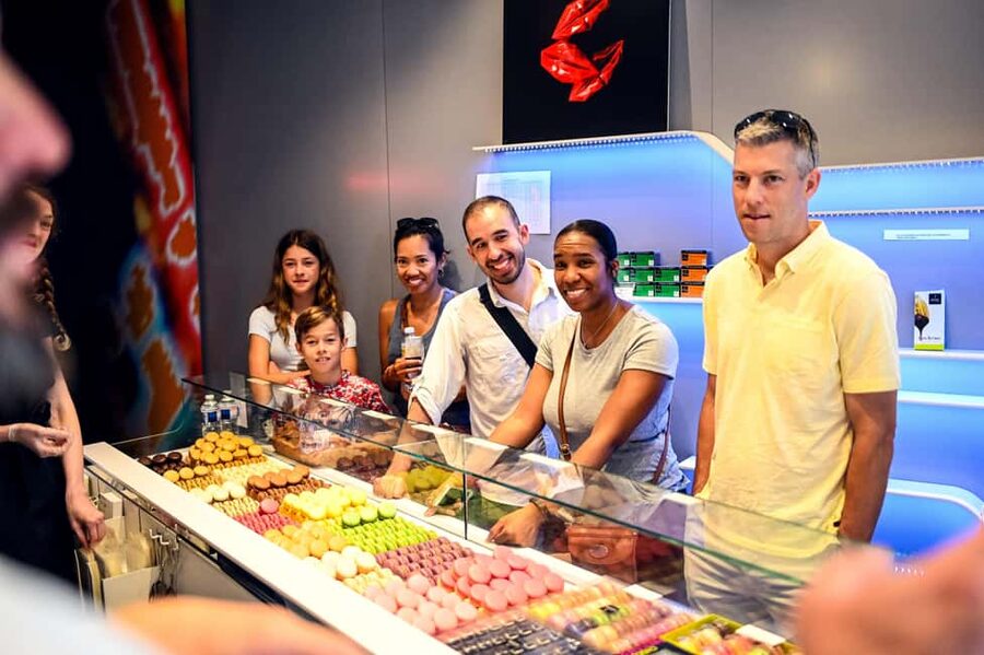 Paris: Montmartre Food Tour with 10 Local Tastings & Wines - Finding the meeting point under the orange umbrella