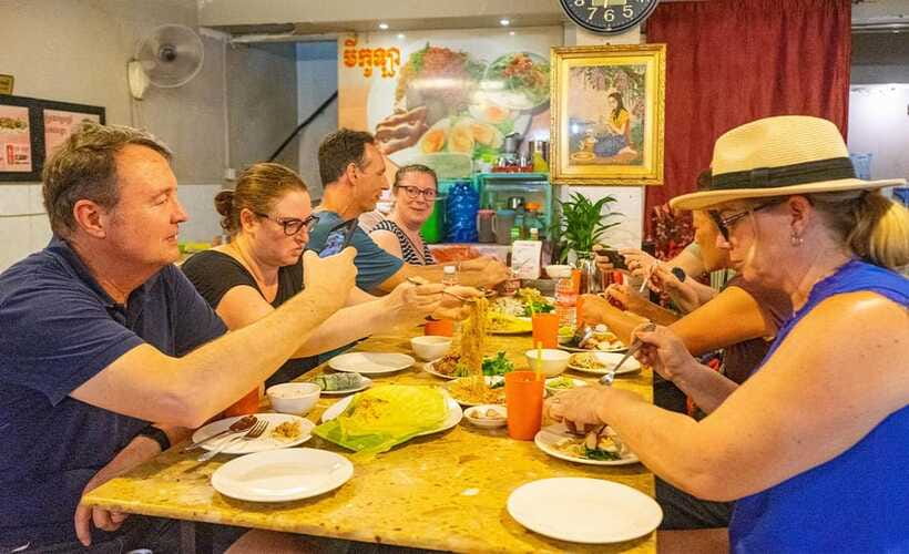 Phnom Penh: Night Foodie Tour by Tuk Tuk with Drinks - Russian Market after dark: BBQ chicken, pork ribs, and dessert wandering