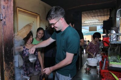 Private Ho Chi Minh Sightseeing and Food Tour by Scooter - Getting picked up, geared up, and ready to ride