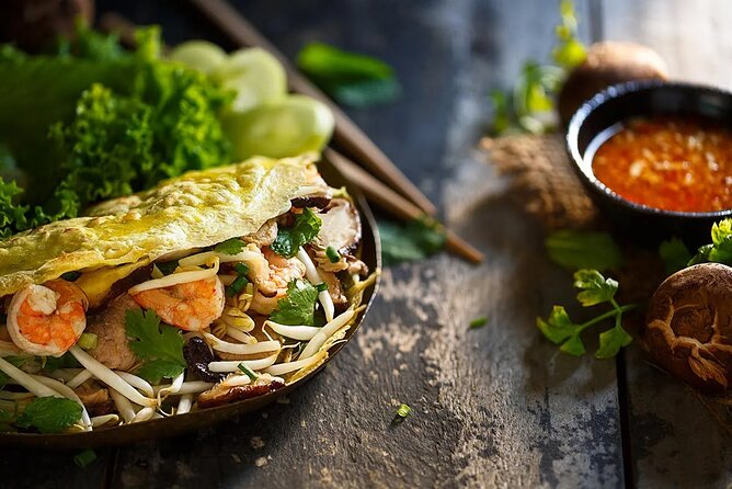 Private Jeep Tour Saigon by Night: Foodie & City Tour - Dinner at two restaurants plus a skybar drink: the foodie part of the deal