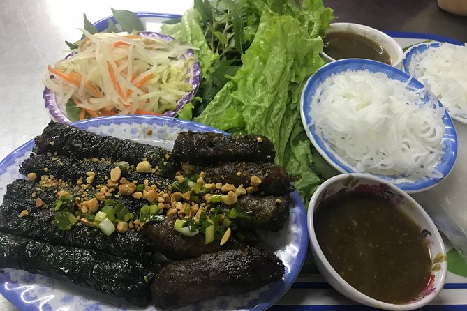 Private Saigon Night Food Tour by Scooter - English guide + food lessons you’ll actually use
