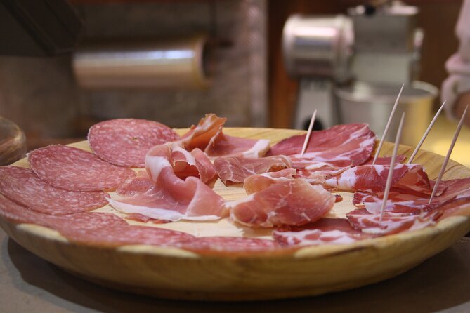 Rome: Trastevere Food Tour Wine Tasting and Local Expert Guide - Stop 2: Tiber Island area with savory-to-sweet tastings