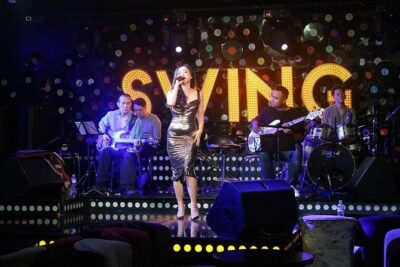Saigon After Dark Vespa Street Food Tour + Live Music 4 hours - Stop 1: Vietnam Vintage Vespa Tours meetup and the first ride