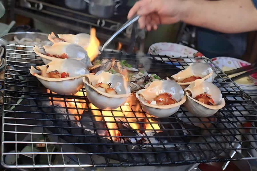 Saigon: Best Price Authentic Walking Street Food Tour - Dessert finish: ice cream, flan cake, and caramel coffee