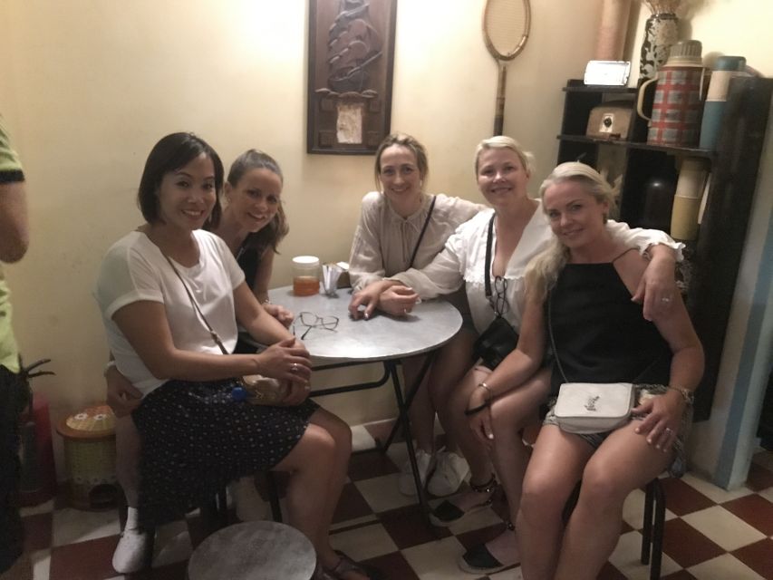 Saigon: Day-Night Sights & Local Food Tour l Female Option - Nguyen Trai Street and Nguyen Van Cu Bridge: snacks, shopping energy, and river views