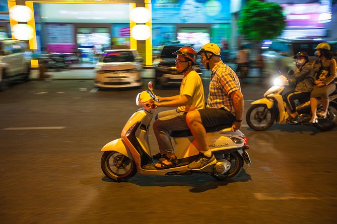 Saigon Night Street Food and City Tour on Scooter - Short sightseeing between meals: lit streets, quick perspective changes