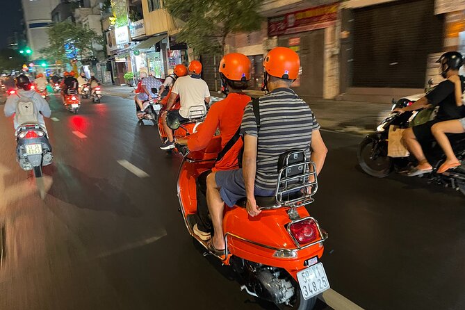 Saigon Vespa By Night Street Food With Female Riders Ao Dai - Women-led Vespa night rides in ao dai: a Saigon night with a built-in guide
