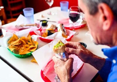 San Francisco: Mission District Food Tour with 6 Tastings - Meeting at the orange umbrella and what the 3-hour pace really means
