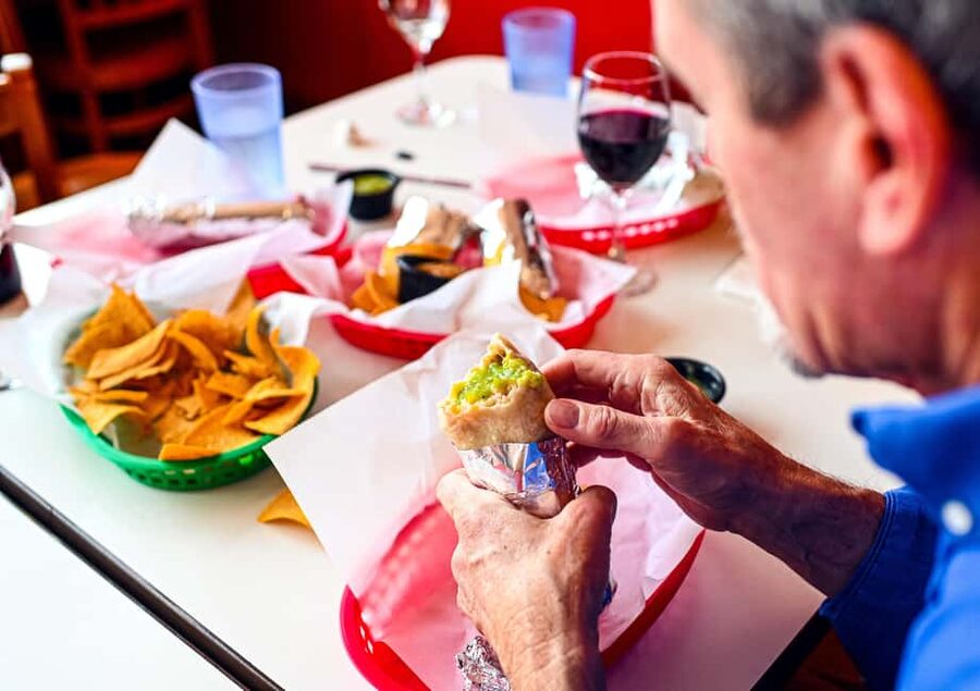 San Francisco: Mission District Food Tour with 6 Tastings - Meeting at the orange umbrella and what the 3-hour pace really means