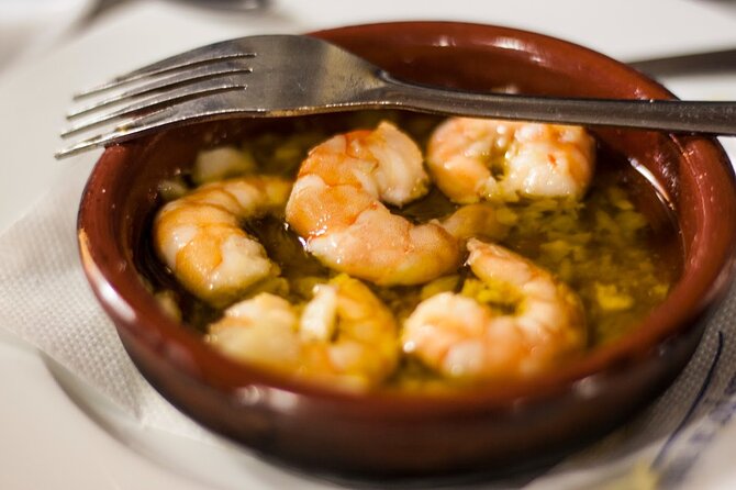 Seville Food Tour: Vermut, Churros & 10+ Tasty Local Dishes - A dodecagonal watchtower with prison history