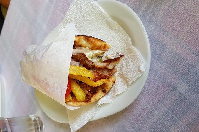 Small Group Greek Traditional Food Tour in Athens 20+ Tastings - The taverna meal: gyros plus wine from the barrel