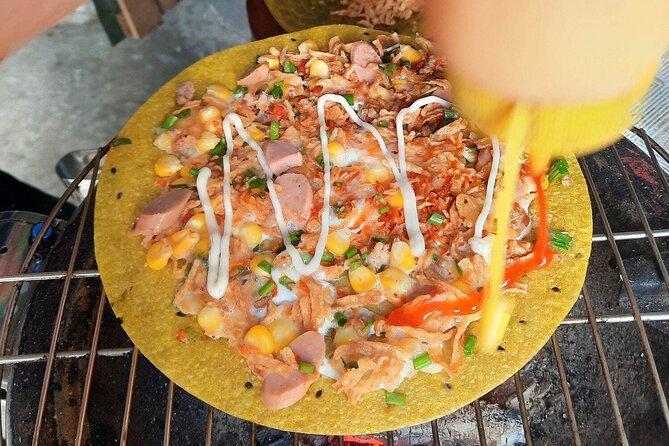 Super Niche Walking Street Food Tour in Ho Chi Minh City - Stop 1: The District 3 launch and taxi-to-food momentum