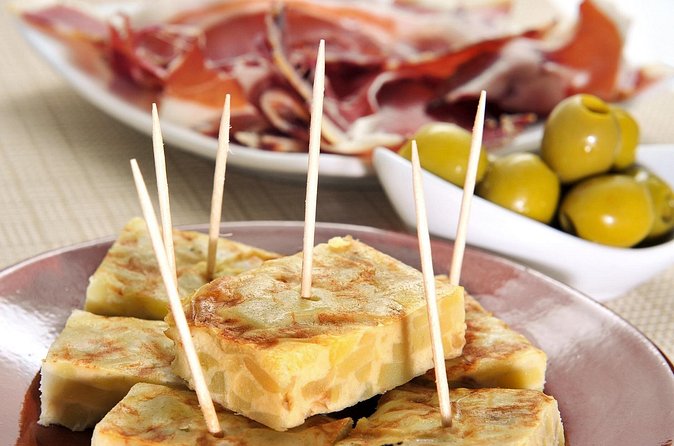 Tapas and Flamenco Show Small Group Tour in Barcelona - El Born Ham Shop: Jamón Serrano and Manchego-Style Cheeses