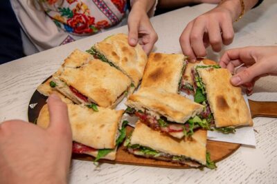 Taste the Flavours of Florence: Private Tuscan Food Tour - Stop 2: Crossing toward Santa Croce for wine, plates, and artist-area stories