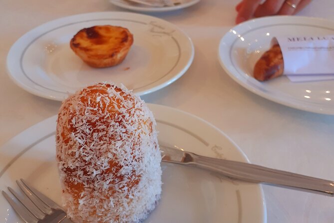 Tastes of Lisbon - Private food Tour - The restaurant moments: codfish, fish cakes, cheeses, and tinned seafood