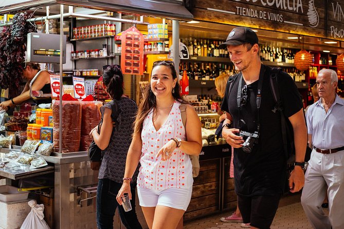 The 10 Tastings of Valencia With Locals: Private Food Walking Tour - Stop 2: La Lonja de la Seda—classics like aqua de Valencia and manchego